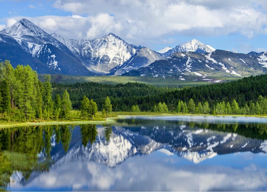 Snow-capped mountains above a river valley